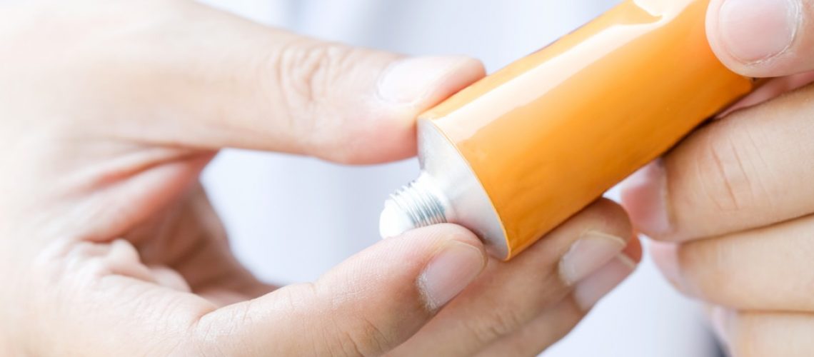 Image of someone applying a topical pain relieving cream